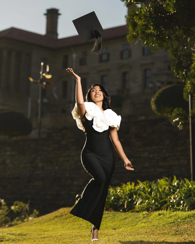 A Fine Shots graduation portrait, cap toss on campus