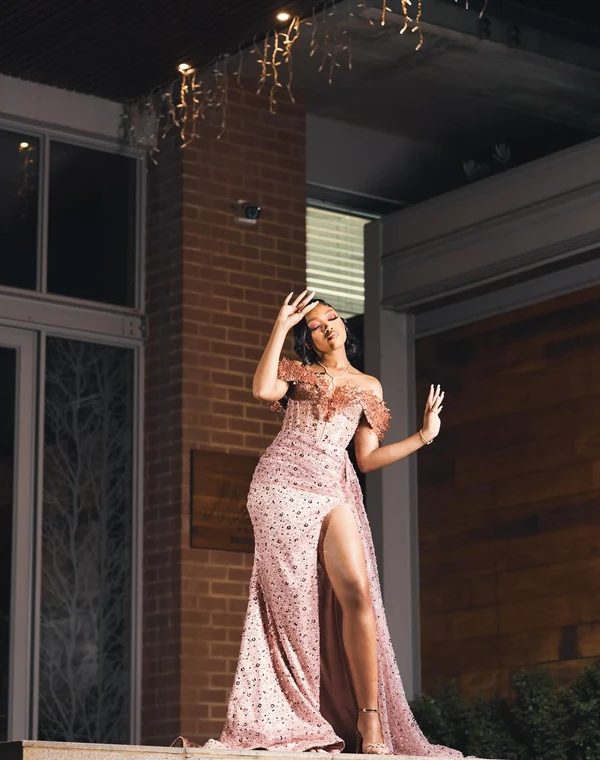 A Fine Shots matric dance portrait, gown on a lit porch
